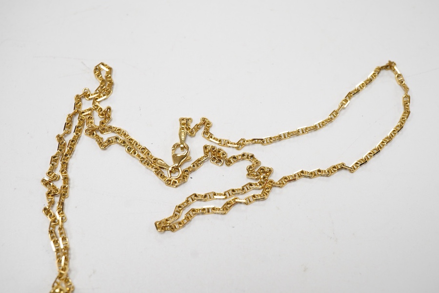 A yellow and white metal metamorphic oval pendant, with central diamond and diamond set border, closed 22mm, open 48mm, on an Italian 750 chain, 58cm, gross weight 16 grams.